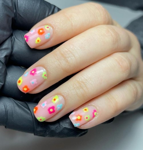 Artistic nail design festival nails using bright colour gloss shades 